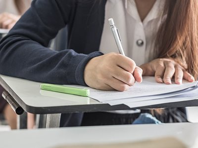 STUDENTS TAKE A SEAT AT THE TABLE